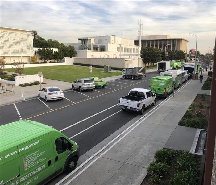 Ariel shot of SERVPRO vehicles in street.