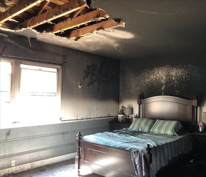 Soot and ash covering a bedroom